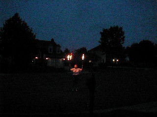 Kim juggling torches